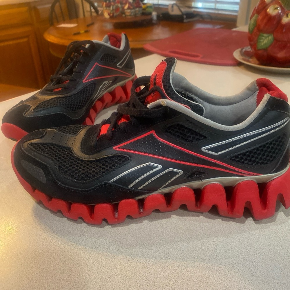 Reebok Black and Red Sneakers with Bold Traction